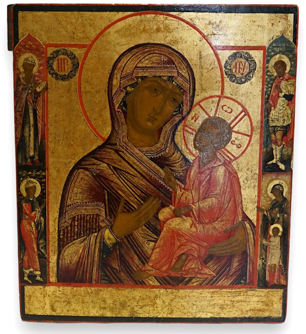 18th century Russian School , The Virgin of Tikhvin with two Royal saints and St John the Warrior, St Ulita and her son, Kirik, oil and gold leaf on wooden panel, 30.5 x 26cm